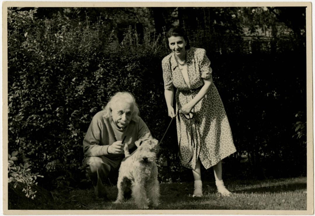 Sepia photography of Albert Einstein with his secretary - Helen Dukas and his dog Chico Marx. Princeton, New Jersey. Copyrights The New York Public Library.