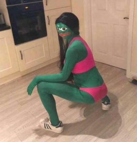 Girl wearing cursed frog costume. It looks a bit like Pepe the frog but in lingerie.