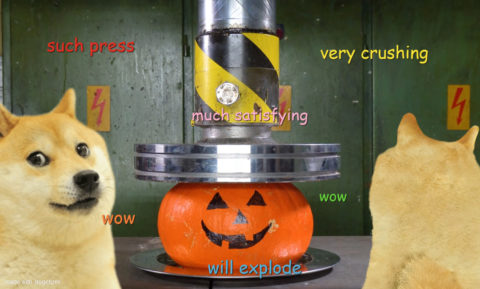 Two doges watching a hydraulic press crushing a smiley faced pumpkin. The pumpkin is about to blow. Such press. Very crushing. Much satisfying. Wow.