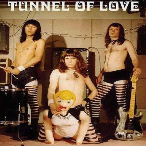 Tunnel Of Love album cover. Long hair dudes posing in their stripy pantyhose. You can gues one has found the tunnel.