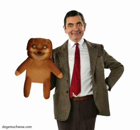 Mr Bean (Rowan Atkinson) holding his Teddy Cheems.