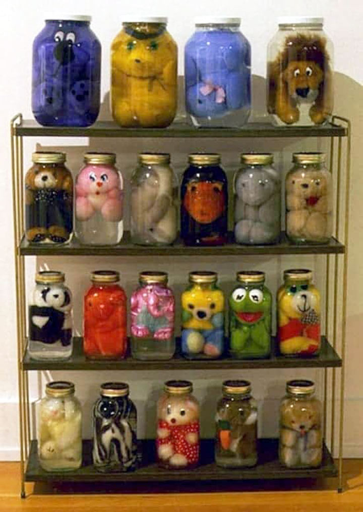 Cursed Toy Image: A collection of toy filled jars. What maniac did this?