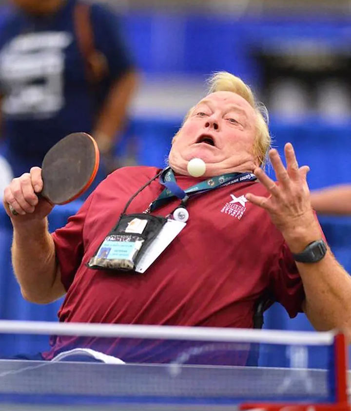 Cursed sports images: Man getting hit with ping pong ball.