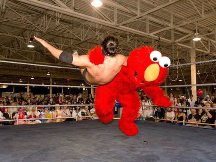 Cursed sports images: Elmo kicking ass in the arena.