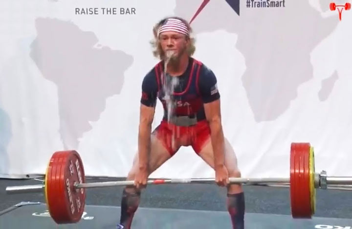 Cursed sports images: Weightlifting leads to vomit.