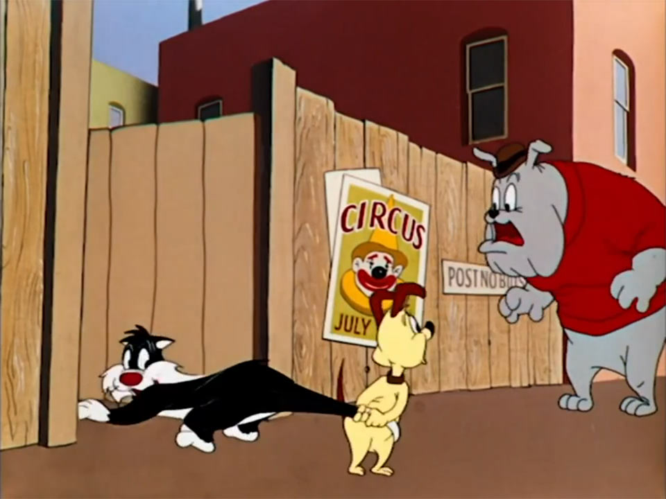 Screen cap from Looney Tunes depicting Sylvester the Cat caught by dogs. Wow.