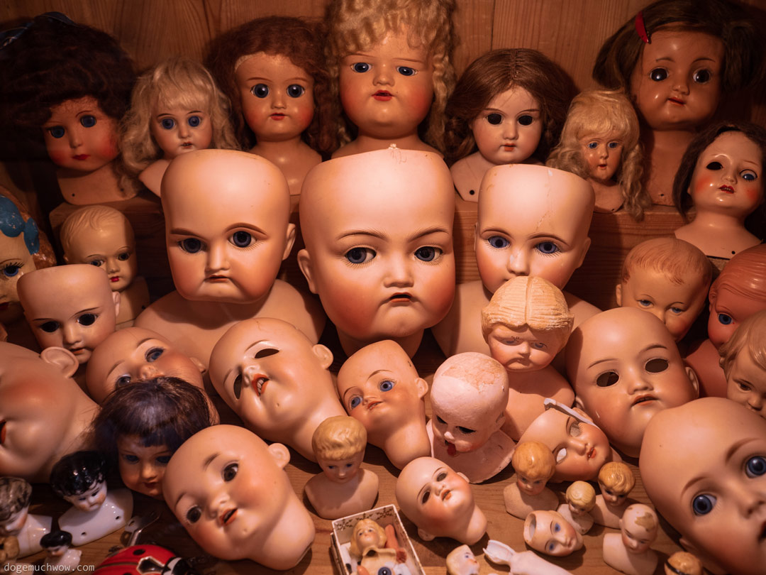 Cursed Doll Image: Creepy doll heads collection.